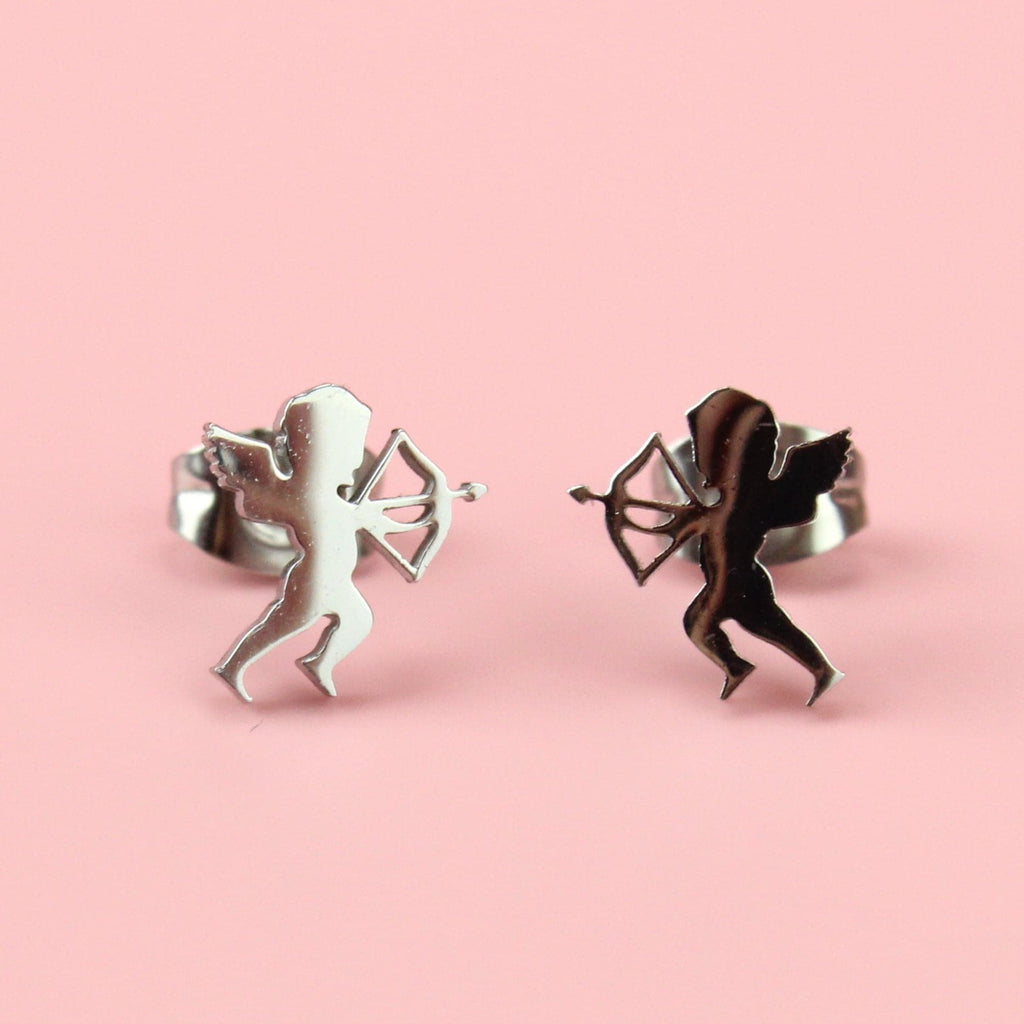 Stainless steel studs in the shape of a cherub with a bow and arrow
