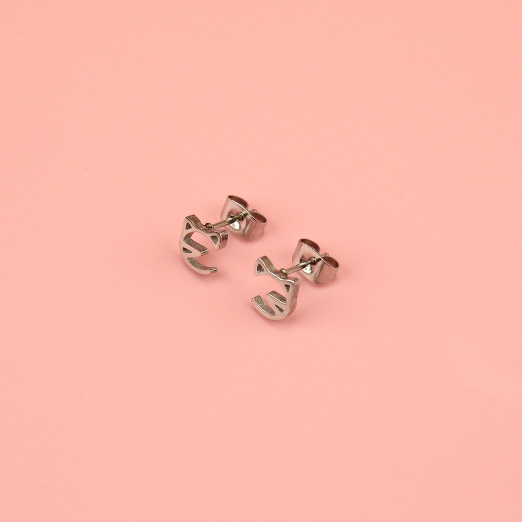 Stainless steel studs with a cut out cat face design