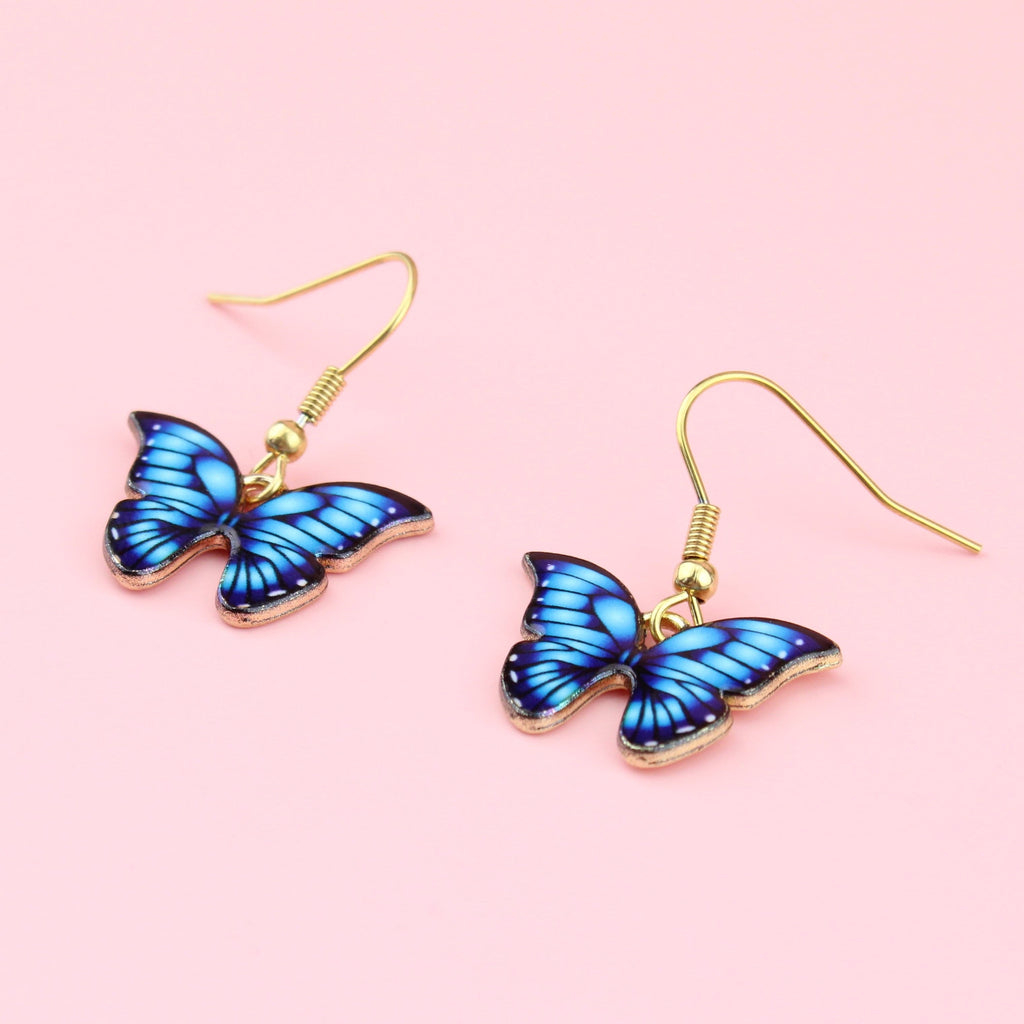 Bright blue butterfly charms on gold plated stainless steel earwires 