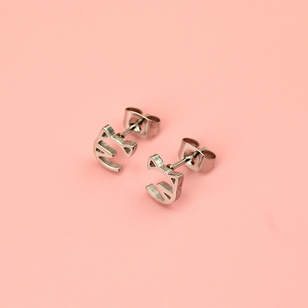 Stainless steel studs with a cut out cat face design