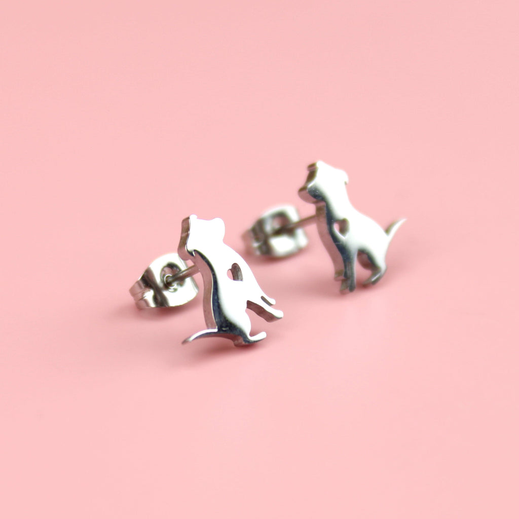 Puppy-shaped studs with a cut out heart