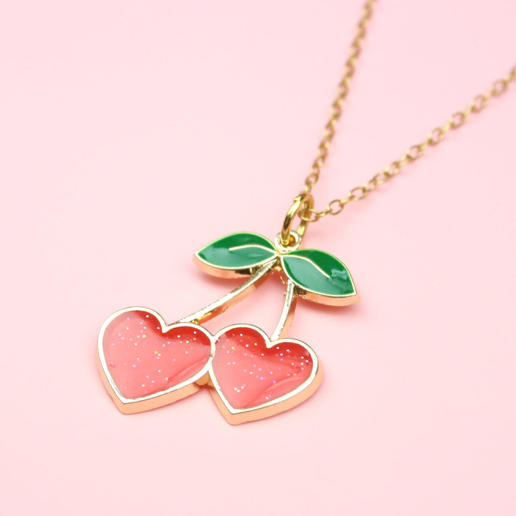 Gold plated stainless steel chain with cherry pendant with sparkly red hearts replacing the cherries