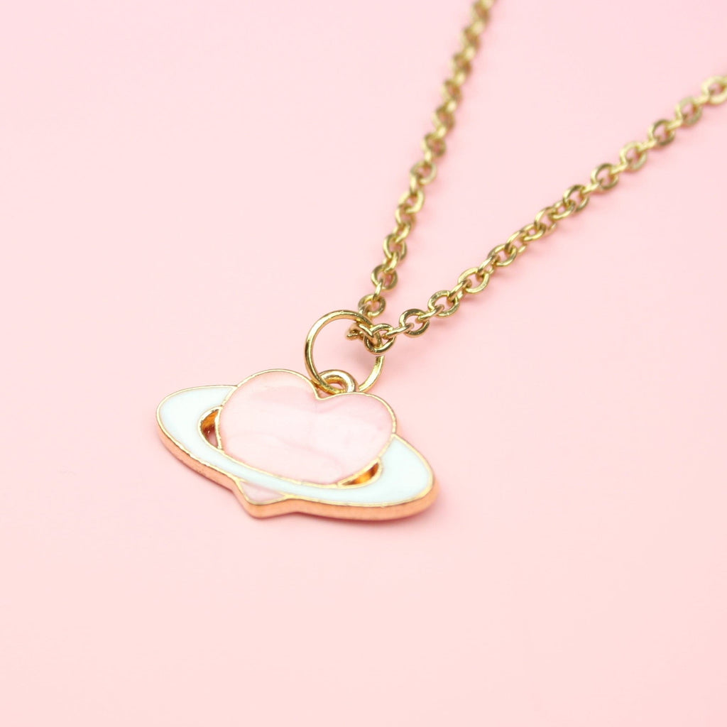 Gold plated & enamel pink heart planet charm on a Gold Plated Stainless Steel chain