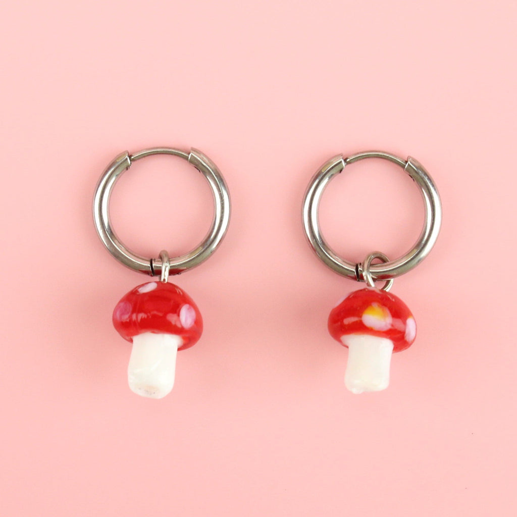 Silver hoop earrings with red toadstool charms