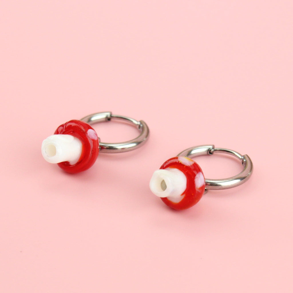 Silver hoop earrings with red toadstool charms