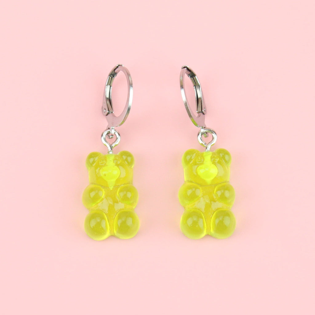 Green gummy bear charms on huggie hoops