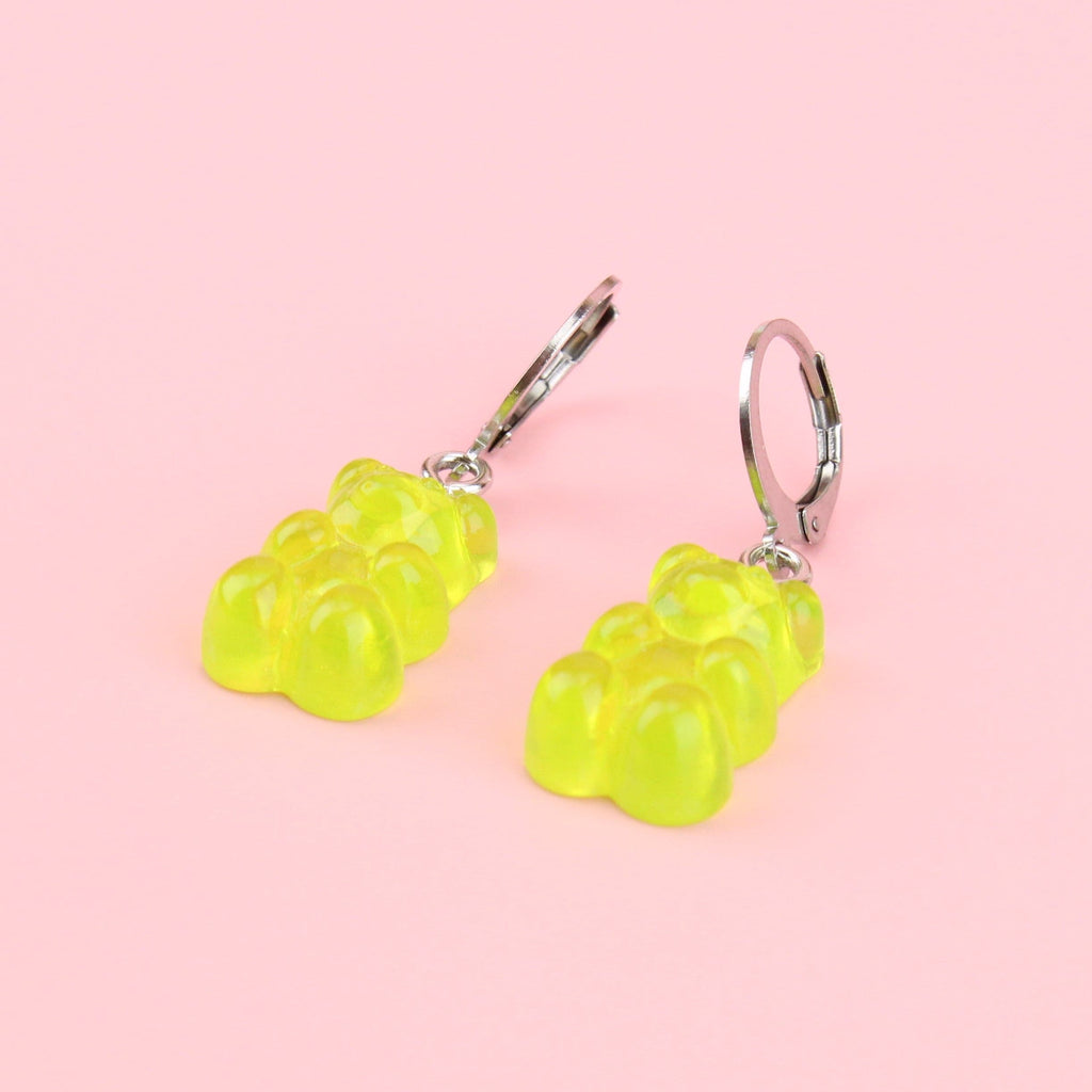 Green gummy bear charms on huggie hoops