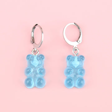 Blue gummy bear charms on stainless steel huggie hoops