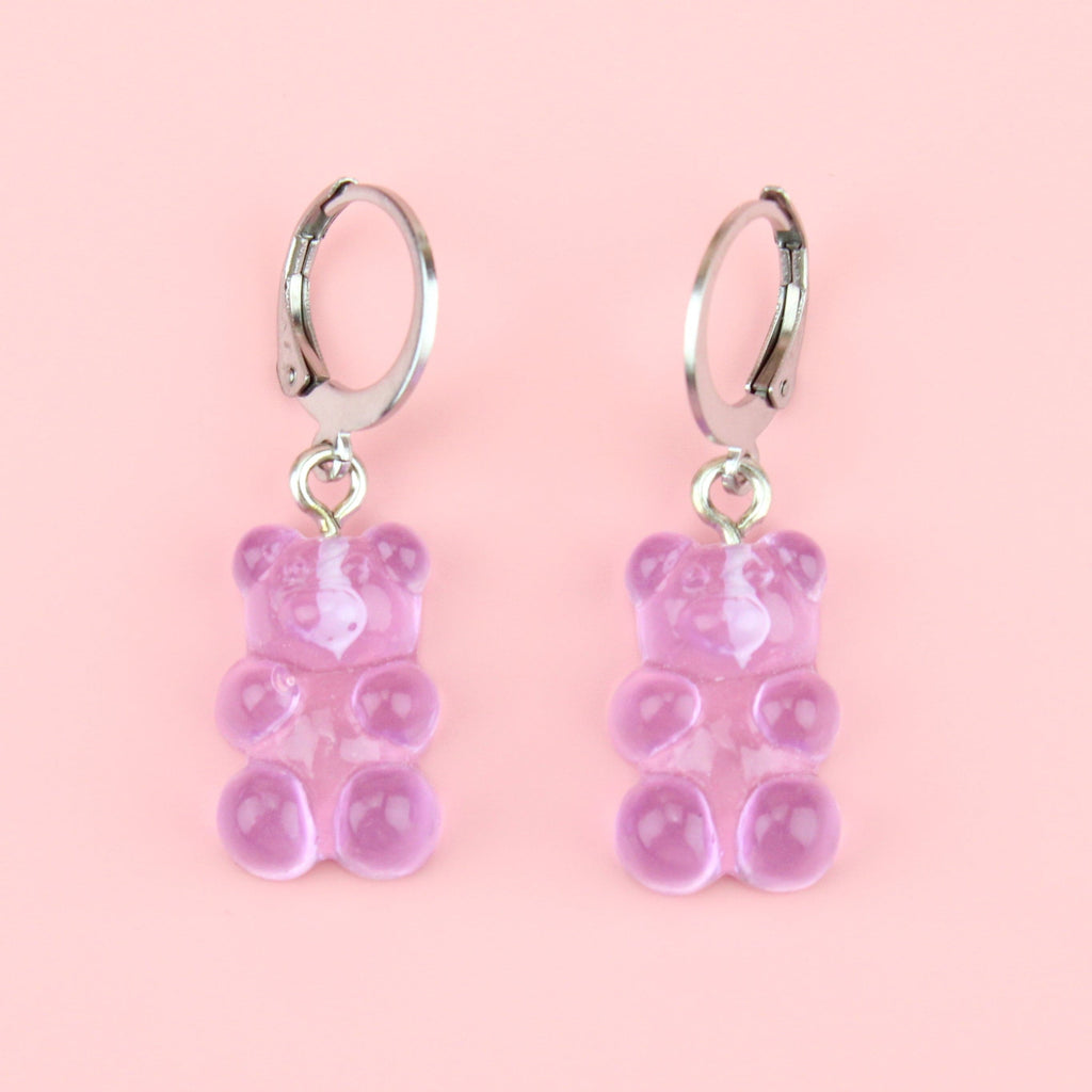 Lilac gummy bear charms on stainless steel huggie hoops