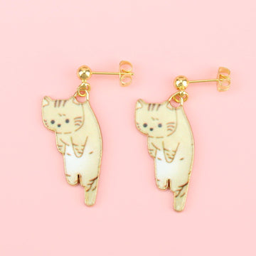 Fawn  cat earrings hanging from gold plated stainless steel studs with a ball at the front