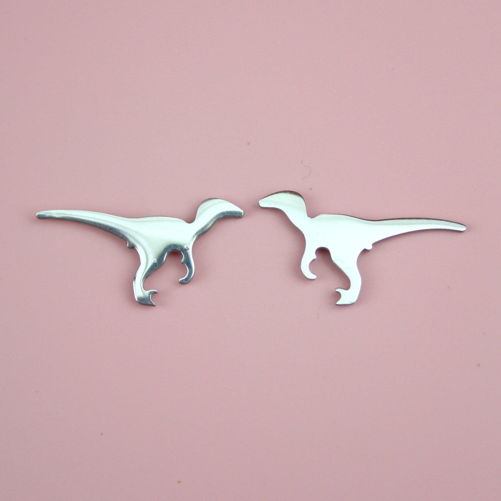 Velociraptor-shaped stainless steel studs