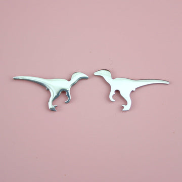 Velociraptor-shaped stainless steel studs