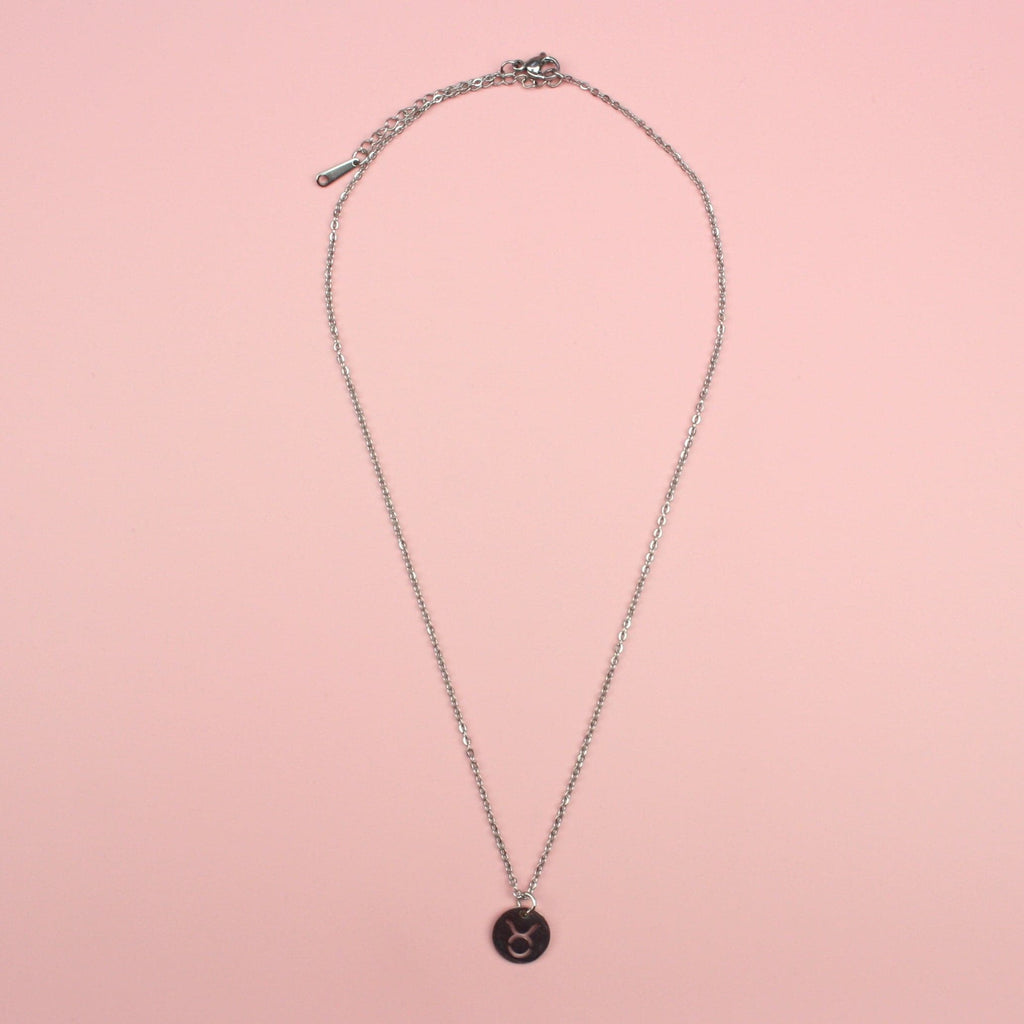Circular taurus symbol pendant on a stainless steel chain