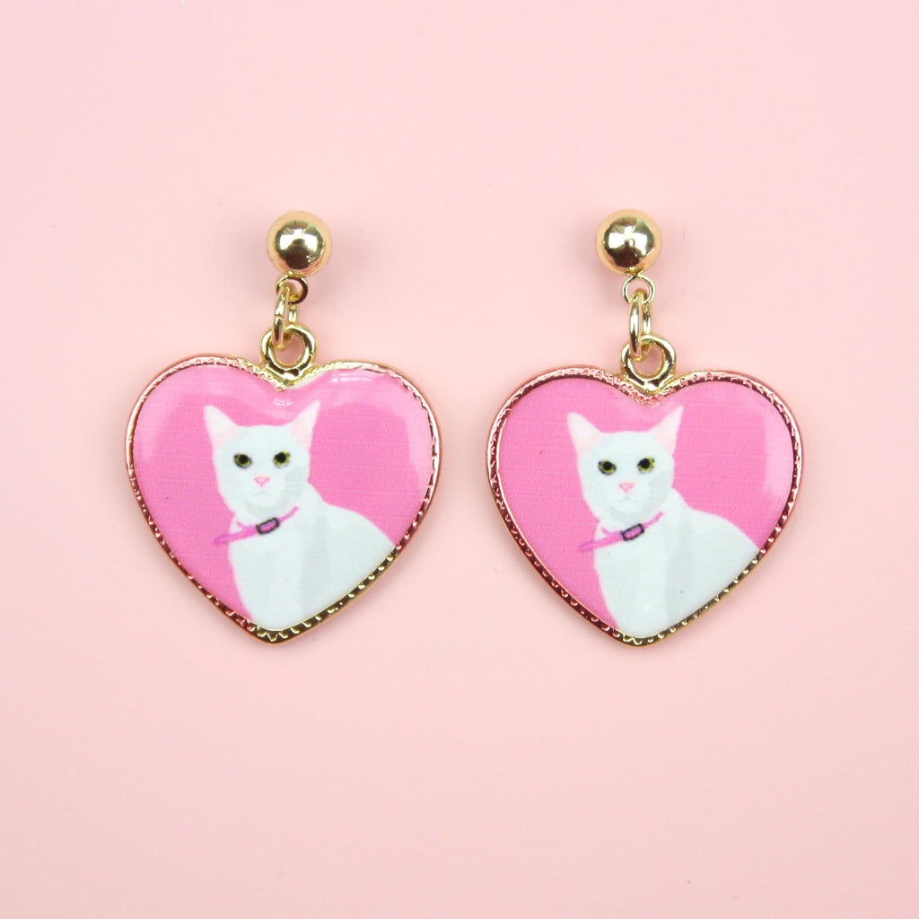 Gold plated stainless steel studs with pink heart charms featuring a portrait of a white cat