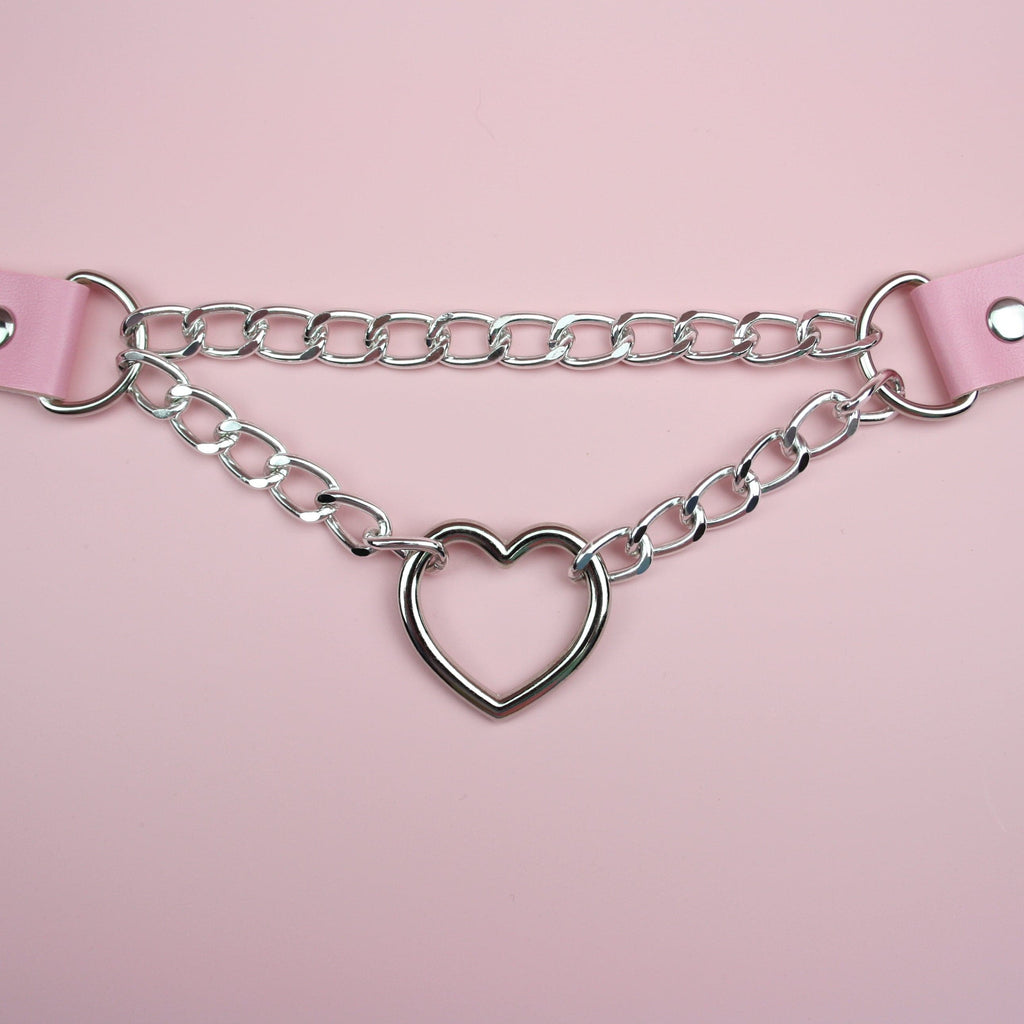 Pink faux leather choker-style necklace with silver plated chain and heart charm