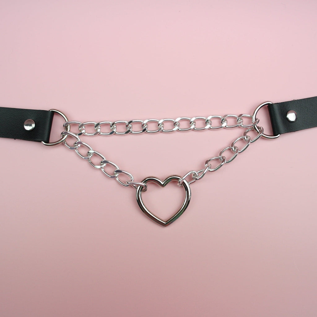 Black faux leather strap with a double chain and cut out heart