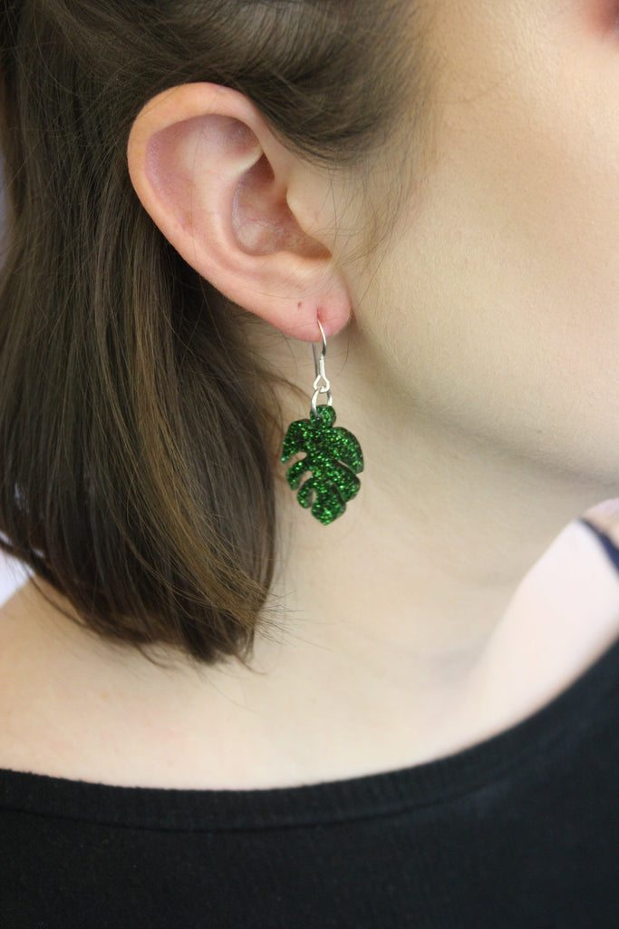 Model wearing Small Moss Green Glitter Monstera Earrings 