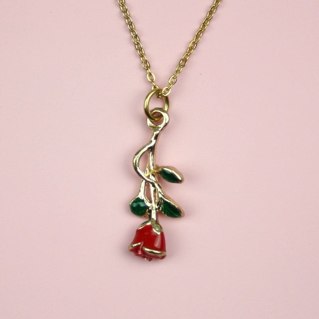 Red Enchanted Rose charm with a green stem on a gold plated stainless steel chain
