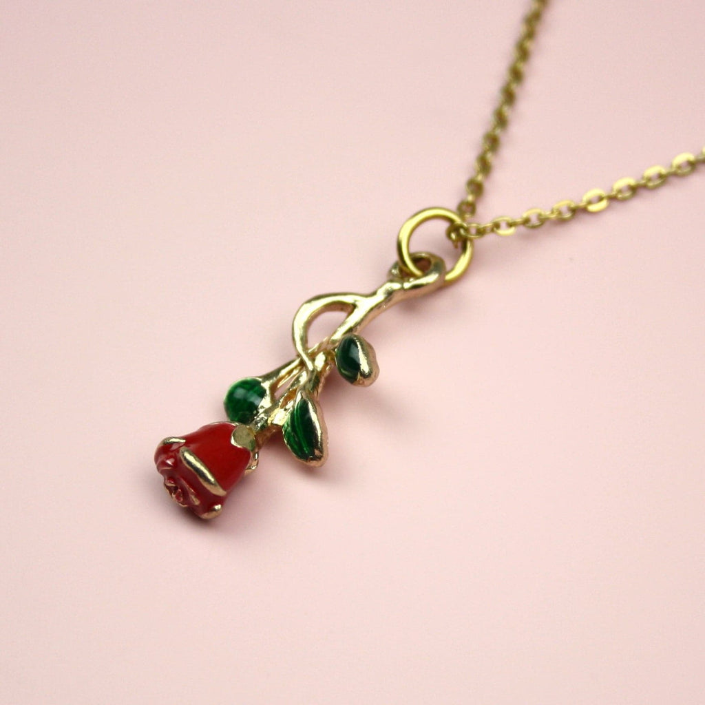 Red Enchanted Rose charm with a green stem on a gold plated stainless steel chain