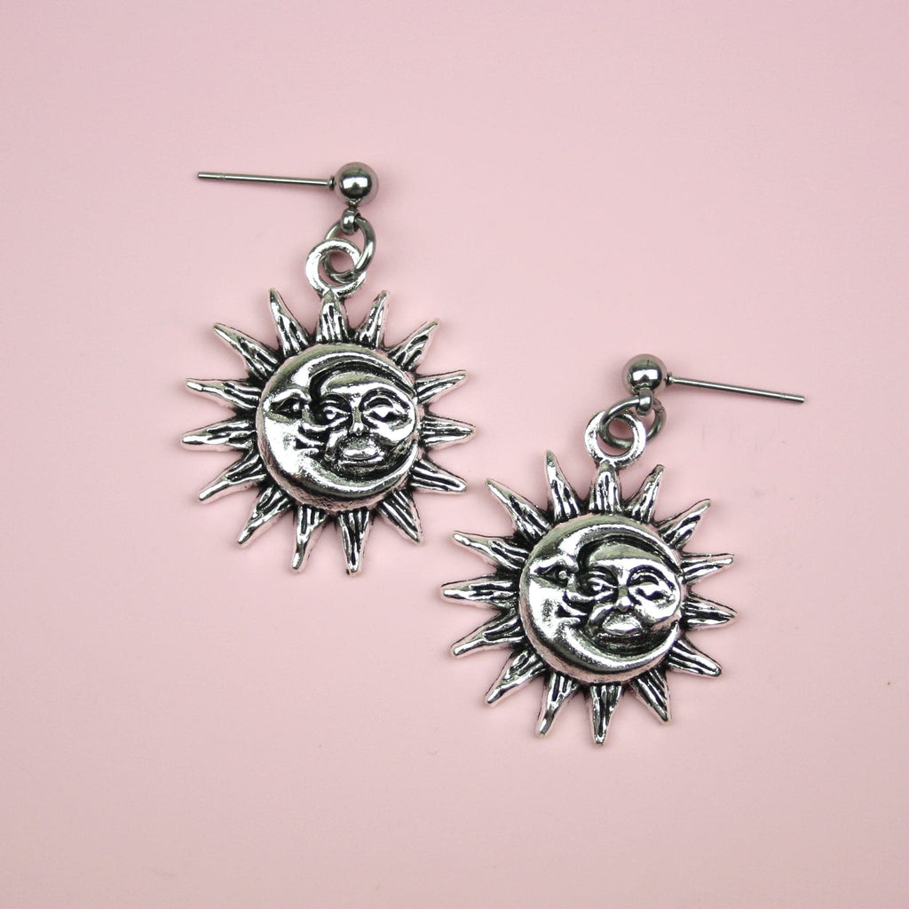 Moon and sun faces with a sun outline on stainless steeel studs