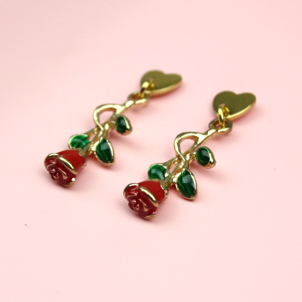 Gold plated heart shaped stainless steel studs with a red rose charm