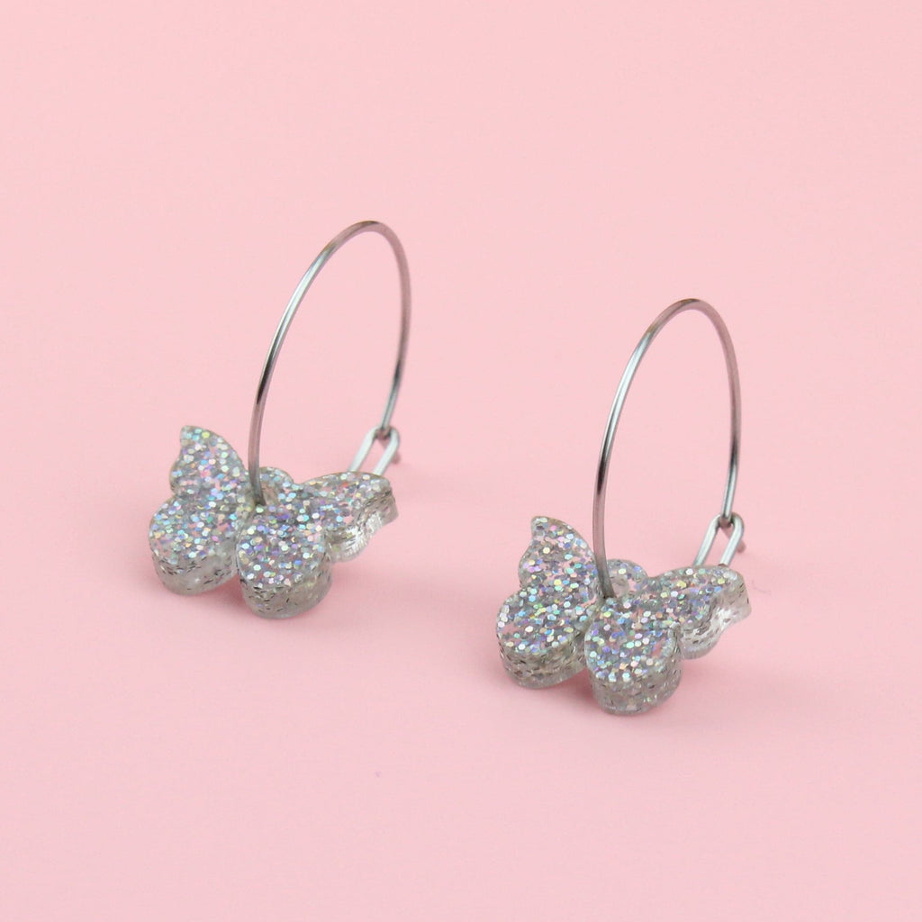 Hologrpahic glitter butterfly charms on stainless steel hoops