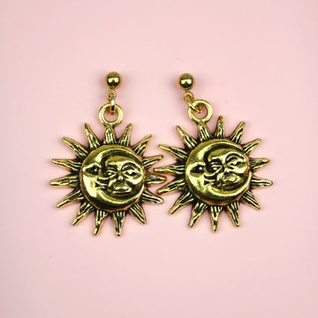 Charms with Moon and Sun Faces with a sun outline on gold plated stainless steel studs