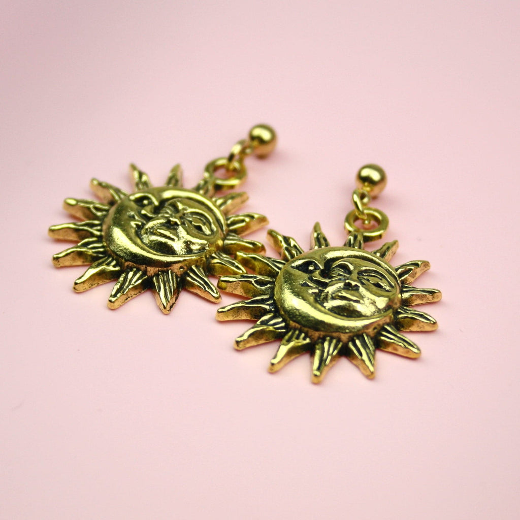 Charms with Moon and Sun Faces with a sun outline on gold plated stainless steel studs
