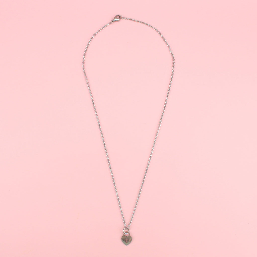 Stainless steel necklace featuring a heart-shaped padlock