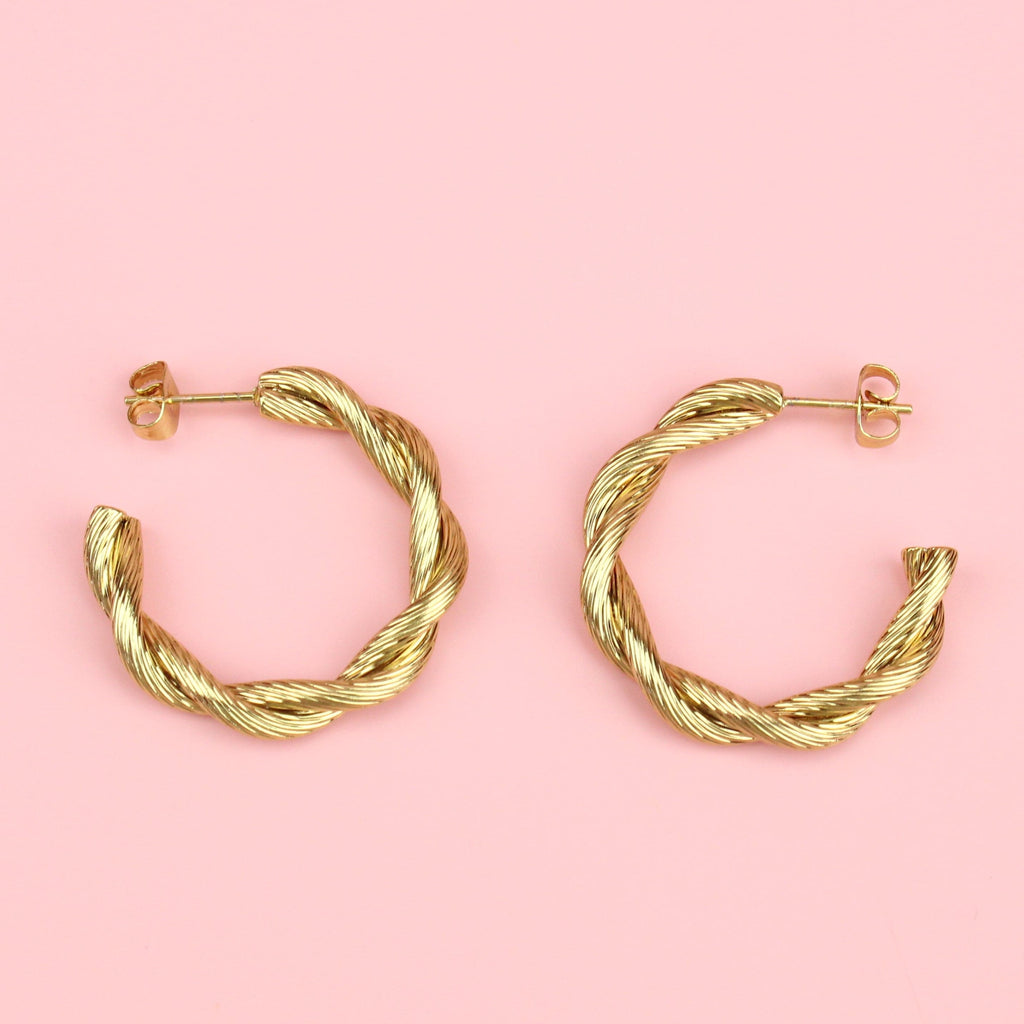 gold hoop earrings with a knotted effect
