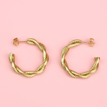 gold hoop earrings with a knotted effect