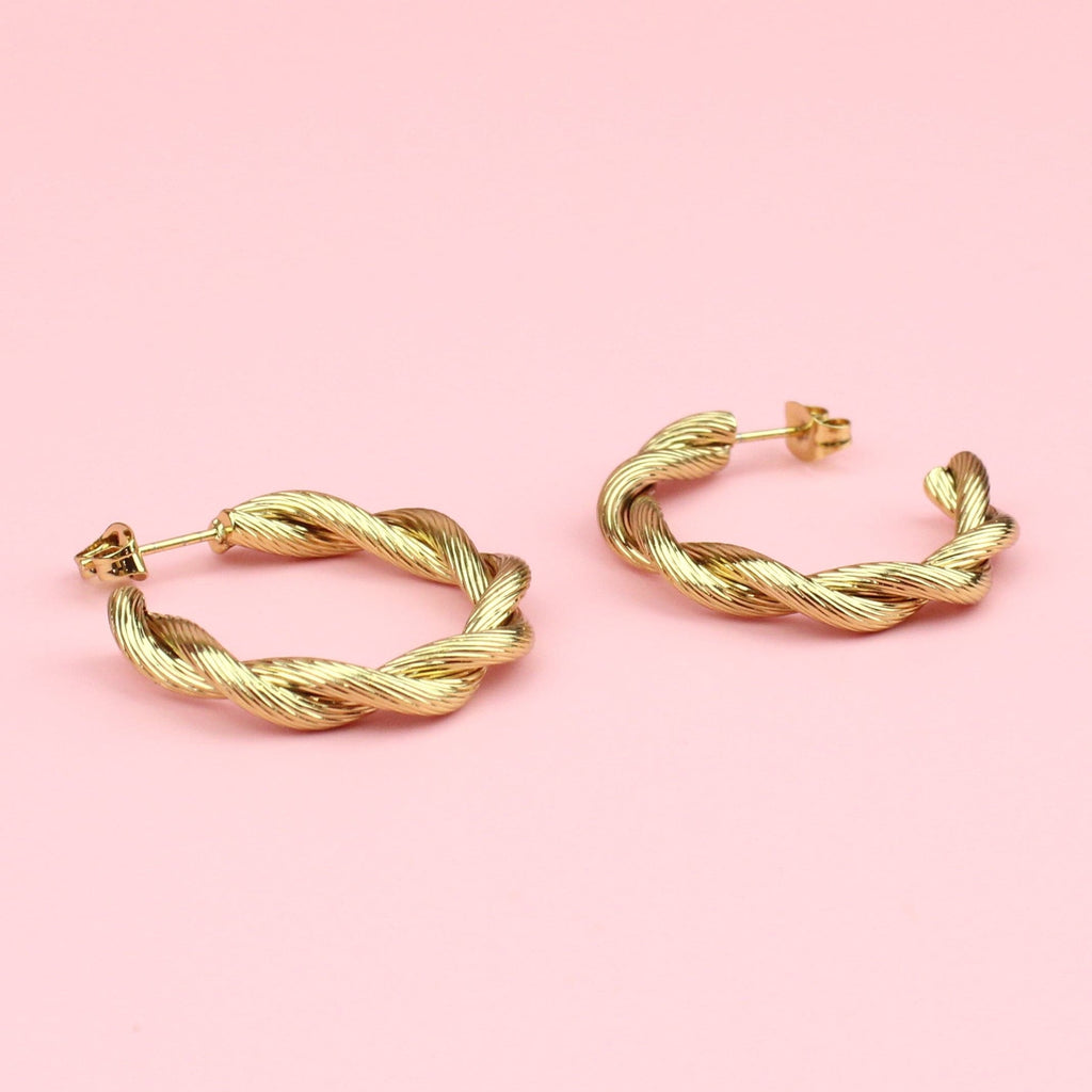 gold hoop earrings with a knotted effect