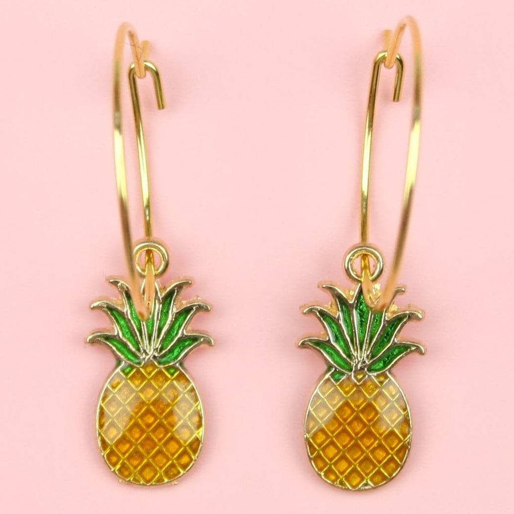 Gold hoop earrings featuring pineapple charms
