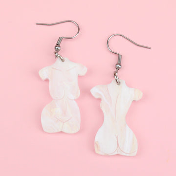 Naked body charms made with white and gold marble acrylic, hung on stainless steel earwires