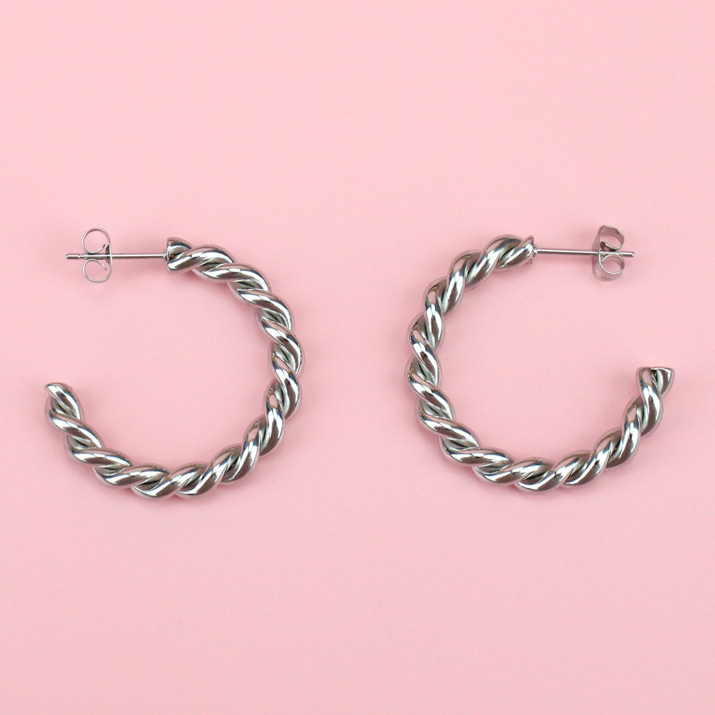 Stainless steel hoops with a twisted tidal design
