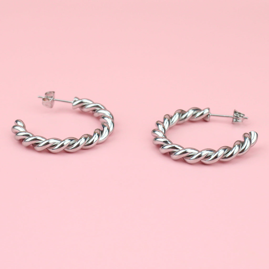 Stainless steel hoops with a twisted tidal design