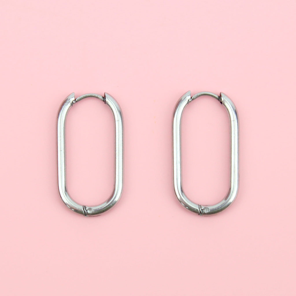 Titanium oval-shaped hoops with a hinge on the top