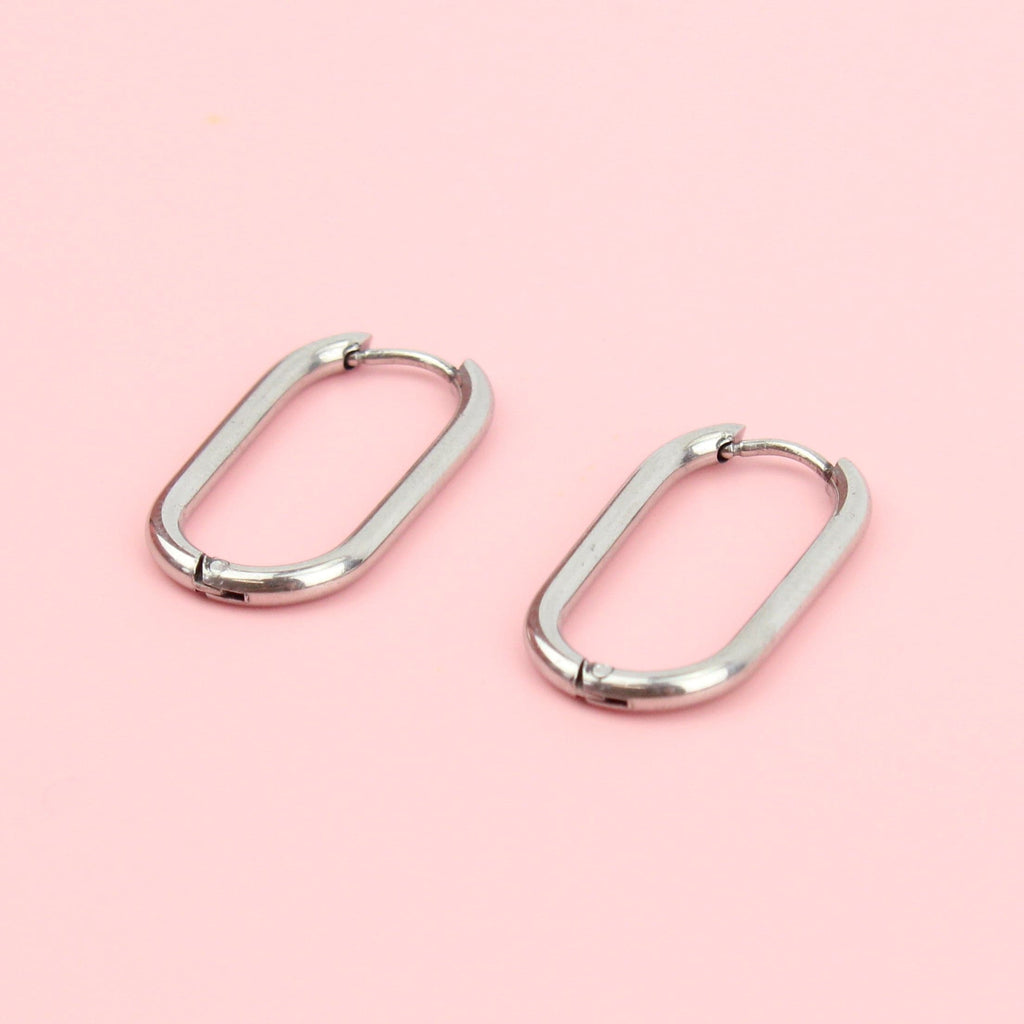 Titanium oval-shaped hoops with a hinge on the top