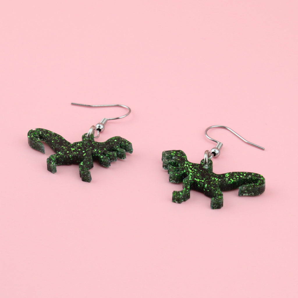 Green glitter perspex t-rex charms on stainless steel earwires
