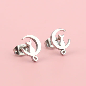 2 crescent moon studs with cats perched on the bottom of the moon