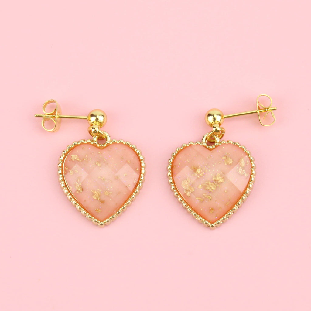 Faceted pink heart charms with gold dust decoration on gold plated stainless steel studs