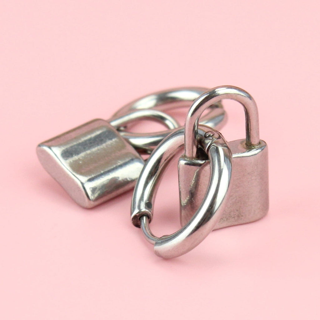 Stainless steel hoop earrings with a padlock charm