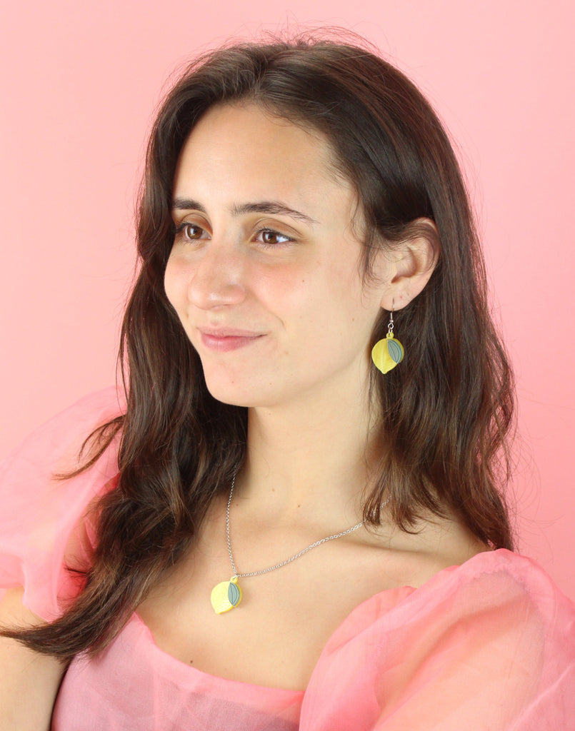 Model wearing When Life Gives You Lemons Earrings with matching necklace