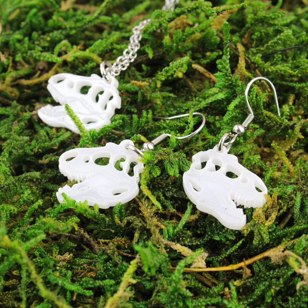 White Marble Perspex T-Rex Charms on stainless steel earwires and matching necklace shown on moss