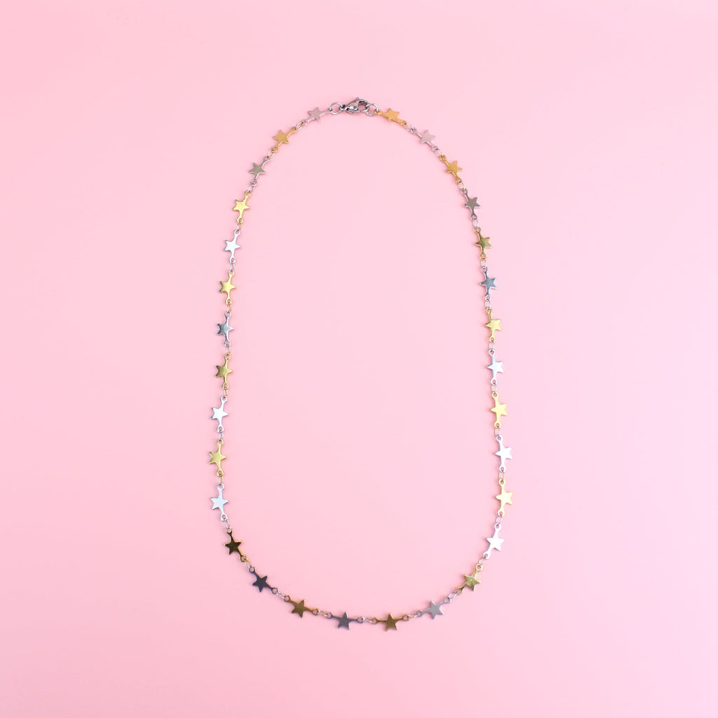 Stainless steel necklace featuring silver and gold star charms