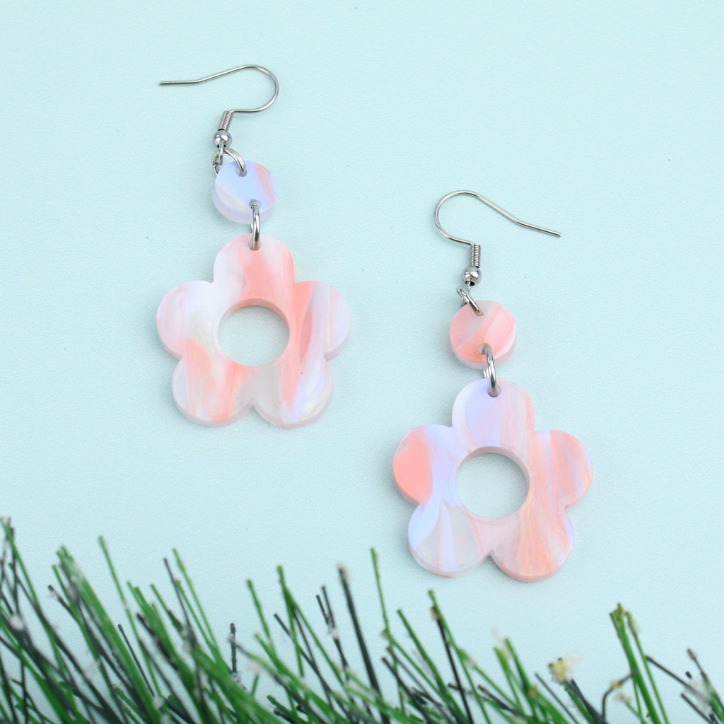 Pastel peach and blue perspex flower charms with cut out middle on stainless steel earwires