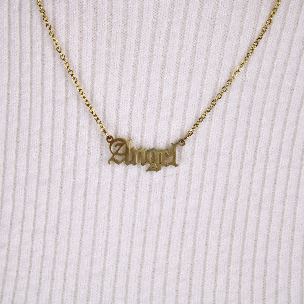 Gold plated stainless steel necklace with the word 'angel' written in a gothic font