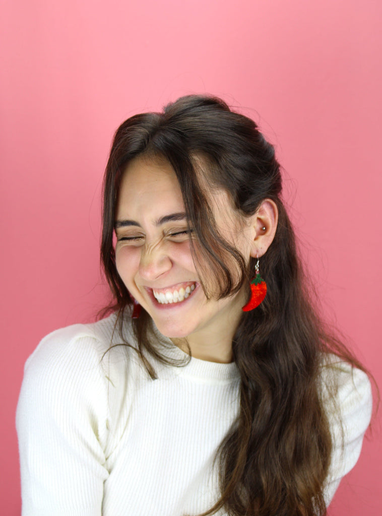 Model wearing the Insanity Chili Pepper Earrings