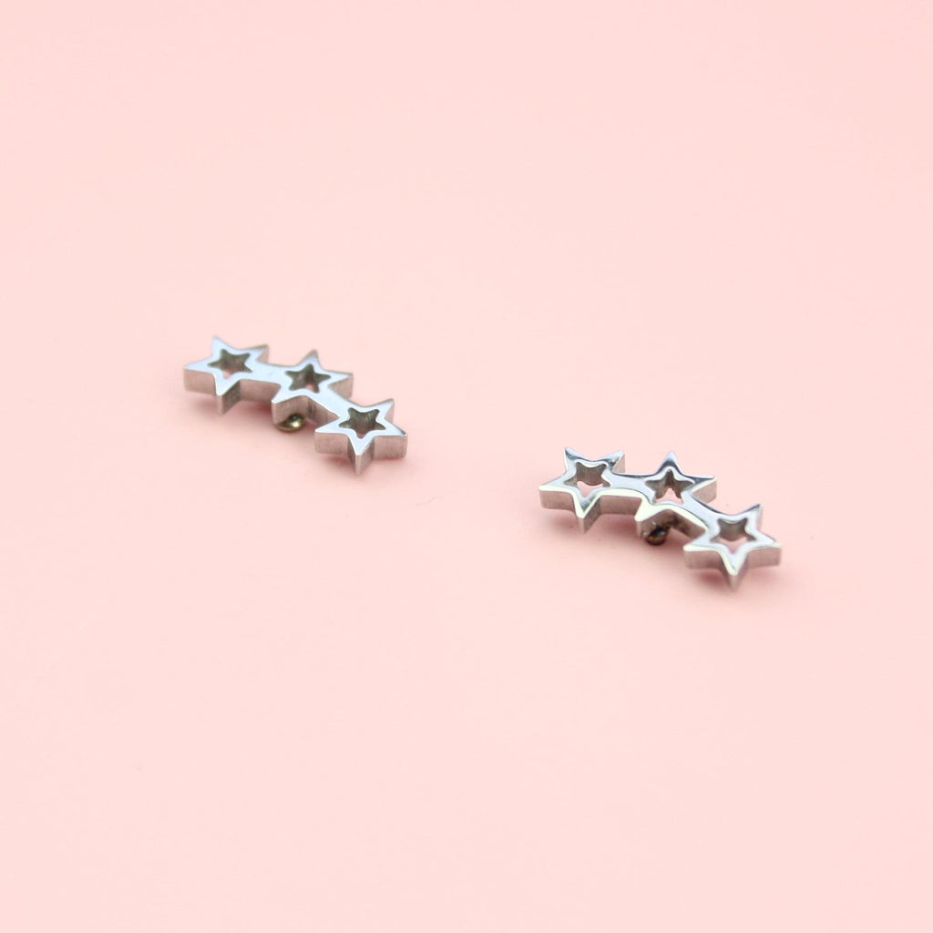 Stainless steel studs featuring a cut out triple star design