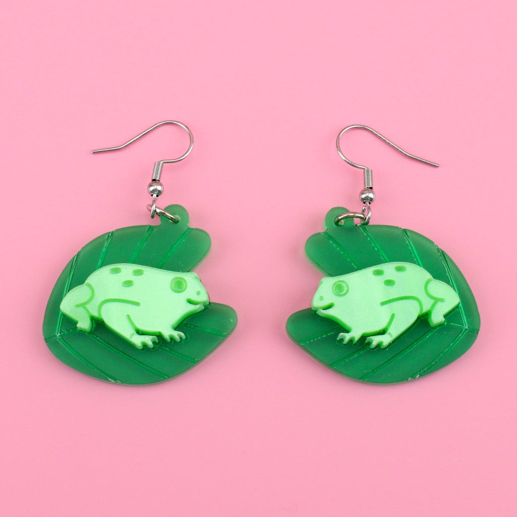 Frosted green perspex and marble acrylic frogs on lilypads hung from stainless steel earwires